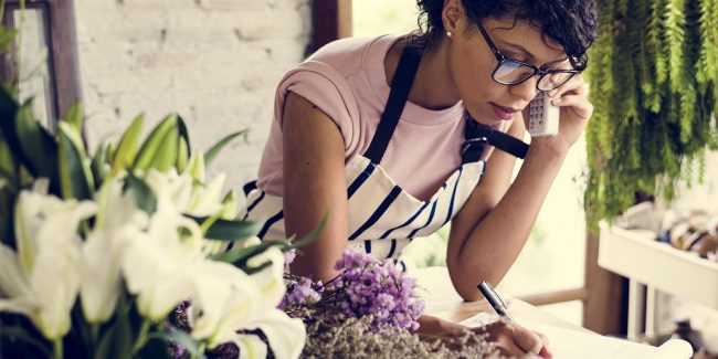 Self-employed woman working with her phone