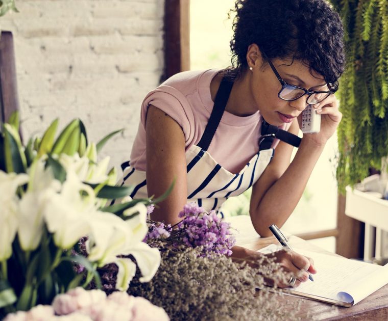 Self-employed woman working with her phone