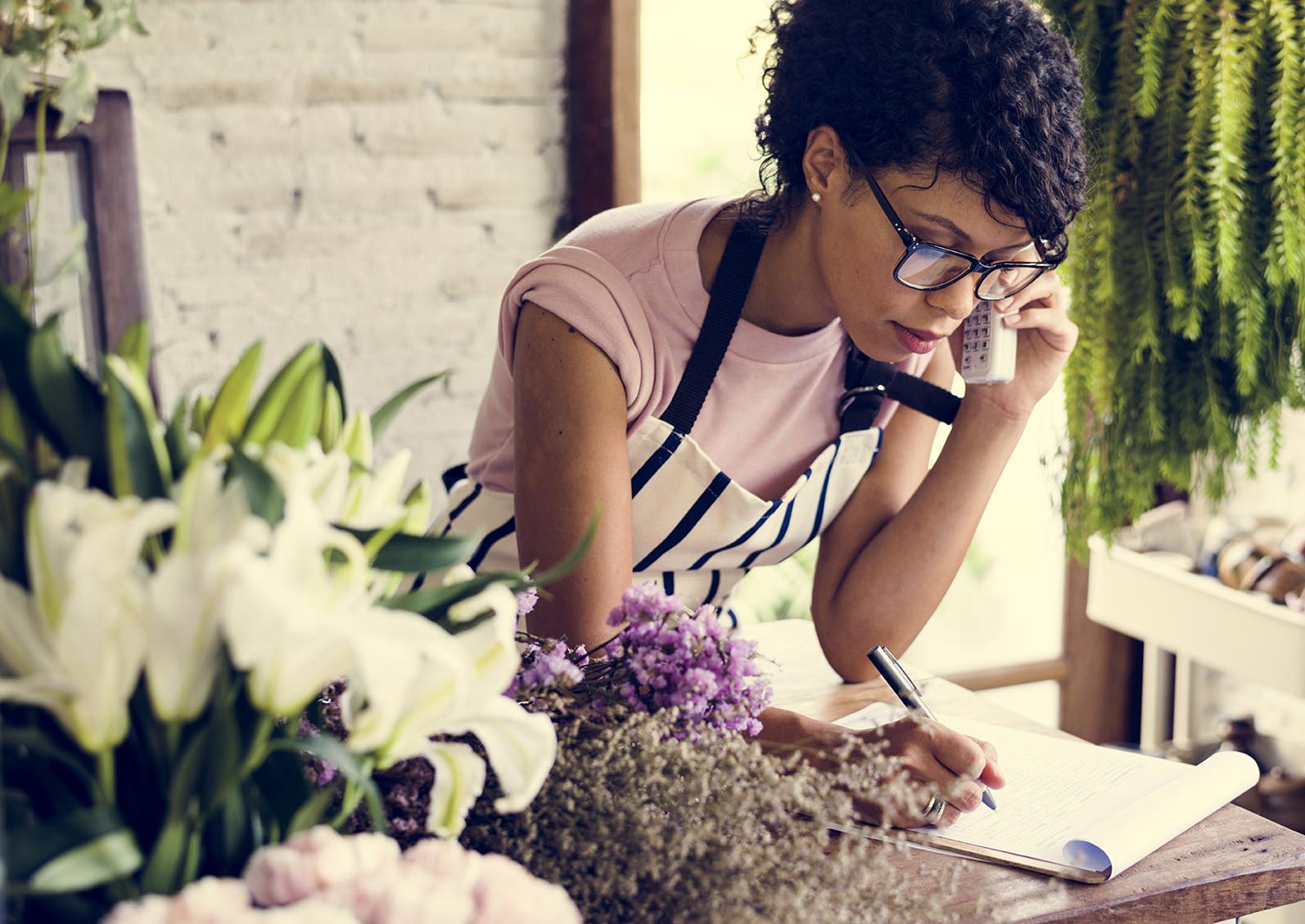 Self-employed woman working with her phone